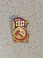 Soviet enamel pin showing hammer and sickle with the date 1917