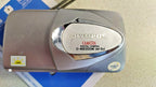 Vintage Olympus digital camera with sliding lens cover