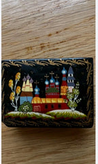 Hand painted jewelry box lid with artist signature at the bottom of the painting