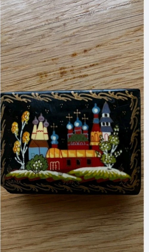 Russian lacquer box open showing bright red interior