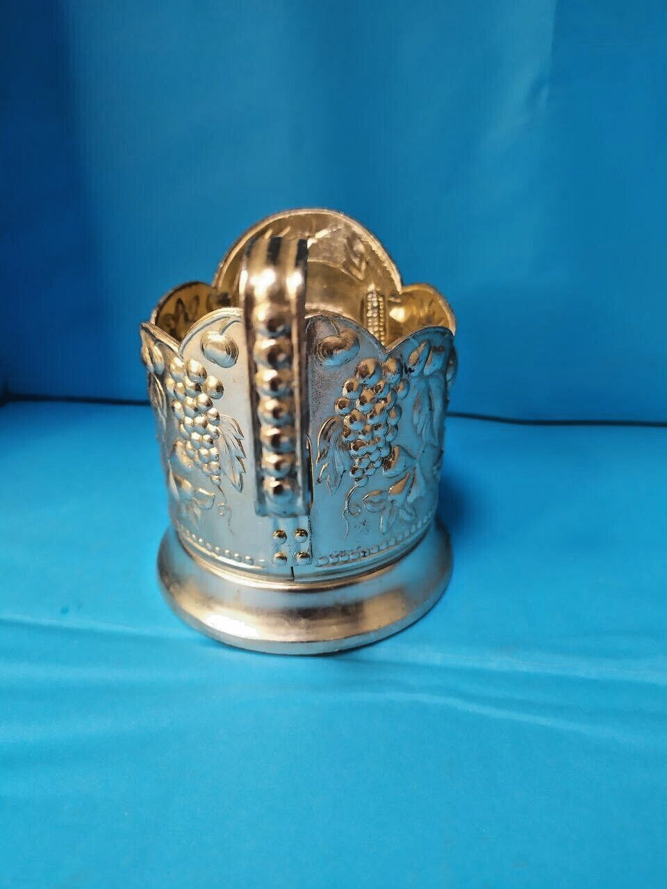 Soviet tea glass holder side view showing the hammer and sickle design