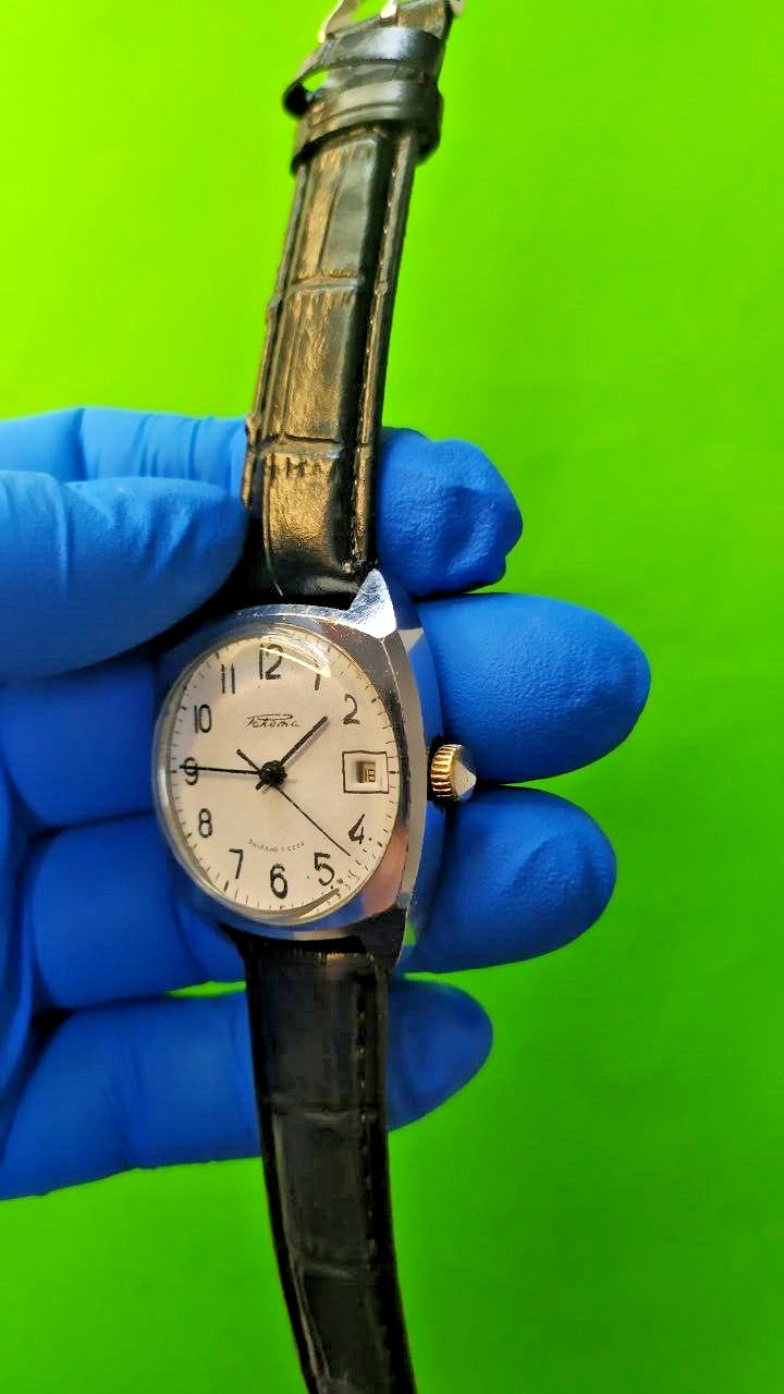 Vintage Raketa Soviet mechanical watch with white dial and date window