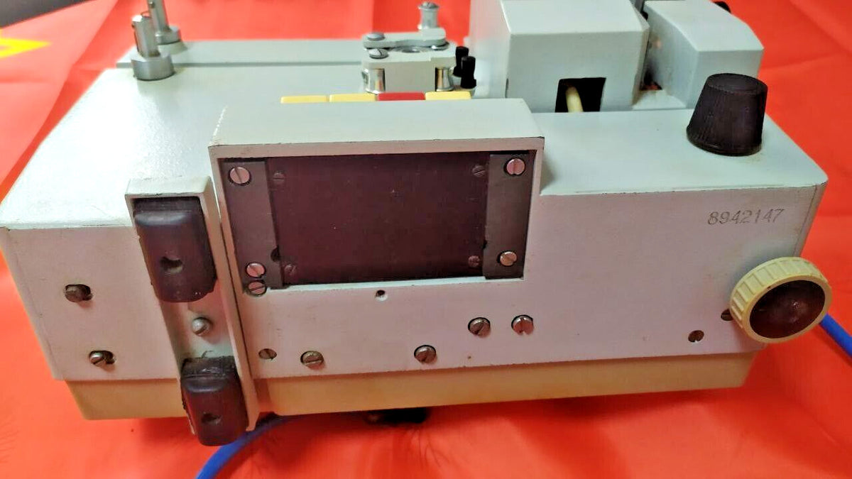 Vintage Soviet movie projector with carrying handle and foldable reel arm – detail 6