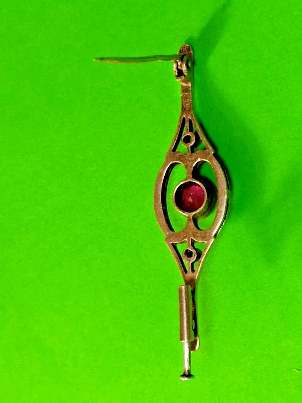 Vintage women's jewelry brooch with ruby in silver setting