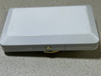 Open Kilian clutch case showing black velvet lining and brand tag – detail 9