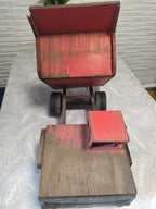 Soviet wooden toy BelAZ shown from the side with worn red paint – detail 7