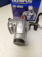 Olympus IS-500 35mm SLR bridge film camera with 28-120mm ED zoom lens in silver champagne color