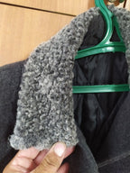 Gold-colored buttons with Ukrainian Trident emblem on general's overcoat – detail 6