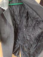 Gold-colored buttons with Ukrainian Trident emblem on general's overcoat – detail 9