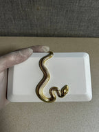 White lacquer evening clutch case with gold snake, side view