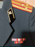Gold bullion shoulder boards with two red stripes and three stars