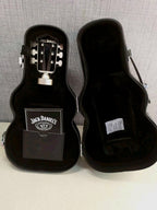 Open guitar-shaped gift case with black velvety lining and bottle compartment