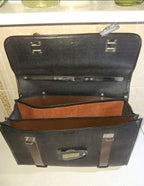Double buckle-strap fasteners and steel base corners on Soviet leatherette briefcase – detail 7