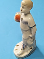 Diamond-shaped Dynamo D emblem on chest of vintage porcelain boy footballer