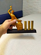 Three brass shell casings used as pen and pencil holders on Soviet souvenir
