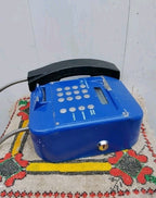 Back of vintage Ukrainian payphone with metal mounting bracket and key lock