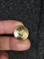 Gold-colored buttons with Ukrainian Trident emblem on general's overcoat