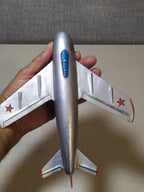 Vintage Soviet toy jet with blue-painted canopy and red star on the tail fin – detail 5