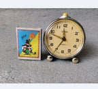Vintage Slava mechanical clock showing scratches and dial aging – detail 7