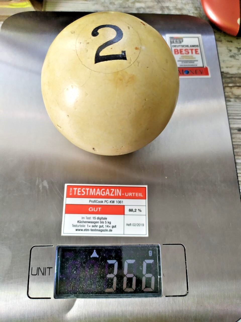 Old Soviet billiard ball next to a caliper showing about 67 mm diameter – detail 10