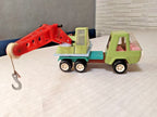 Vintage Soviet toy crane truck with movable red crane arm and side winch wheel