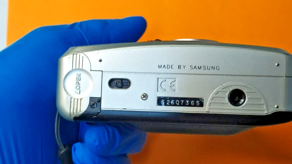 Samsung Fino 30 SE film camera with soft case and wrist strap