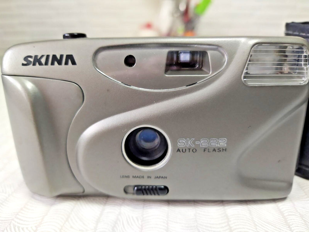 Silver 35mm film camera with original soft case and wrist strap