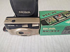 Skina SK-334 with original soft case and wrist strap