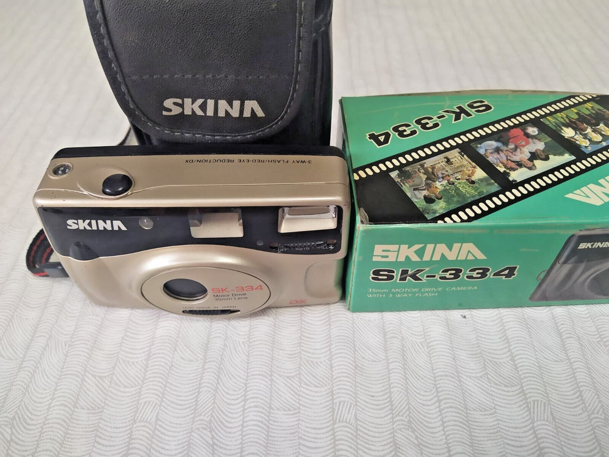 Skina SK-334 with original soft case and wrist strap
