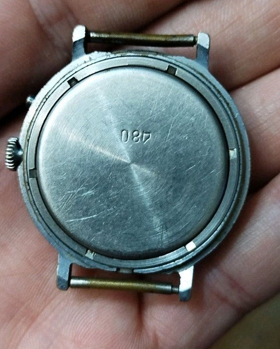 Stainless steel case back engraved with serial number 087