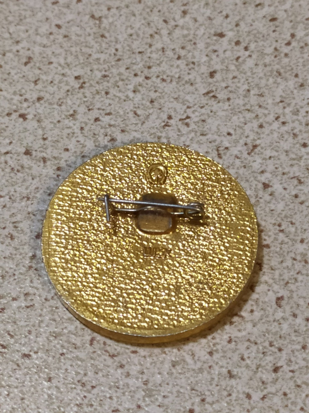 Back of old Soviet October pin with fitting