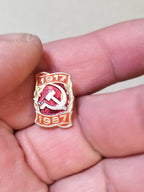Vintage USSR 1987 anniversary badge on plain background