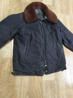 Dark blue Soviet pilot jacket with sheepskin collar buttoned up