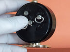 Slava alarm clock showing patina on brass parts