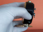 Slava alarm clock showing patina on brass parts – detail 7