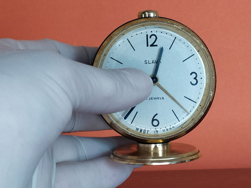 Mechanical Soviet alarm clock with gold-colored stand and matte black case – detail 9