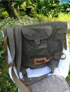 Roll-top flap and front buttoned pocket on a Soviet olive drab rucksack