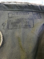 Roll-top flap and front buttoned pocket on a Soviet olive drab rucksack – detail 5