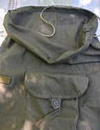 Roll-top flap and front buttoned pocket on a Soviet olive drab rucksack – detail 8