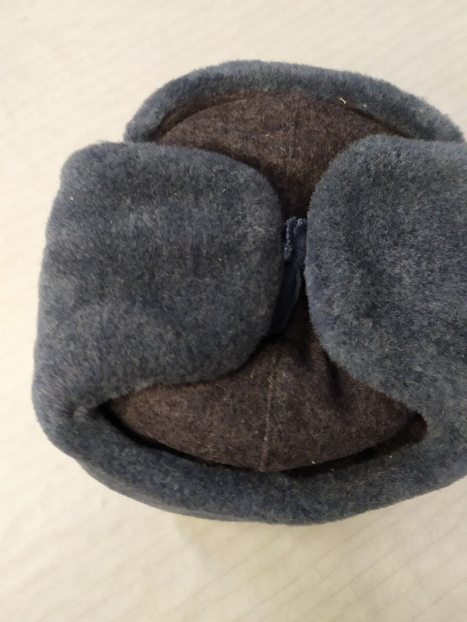 Red enamel Soviet star cockade with hammer and sickle on the ushanka