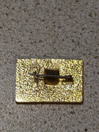 Soviet anniversary pin with cruiser Aurora design