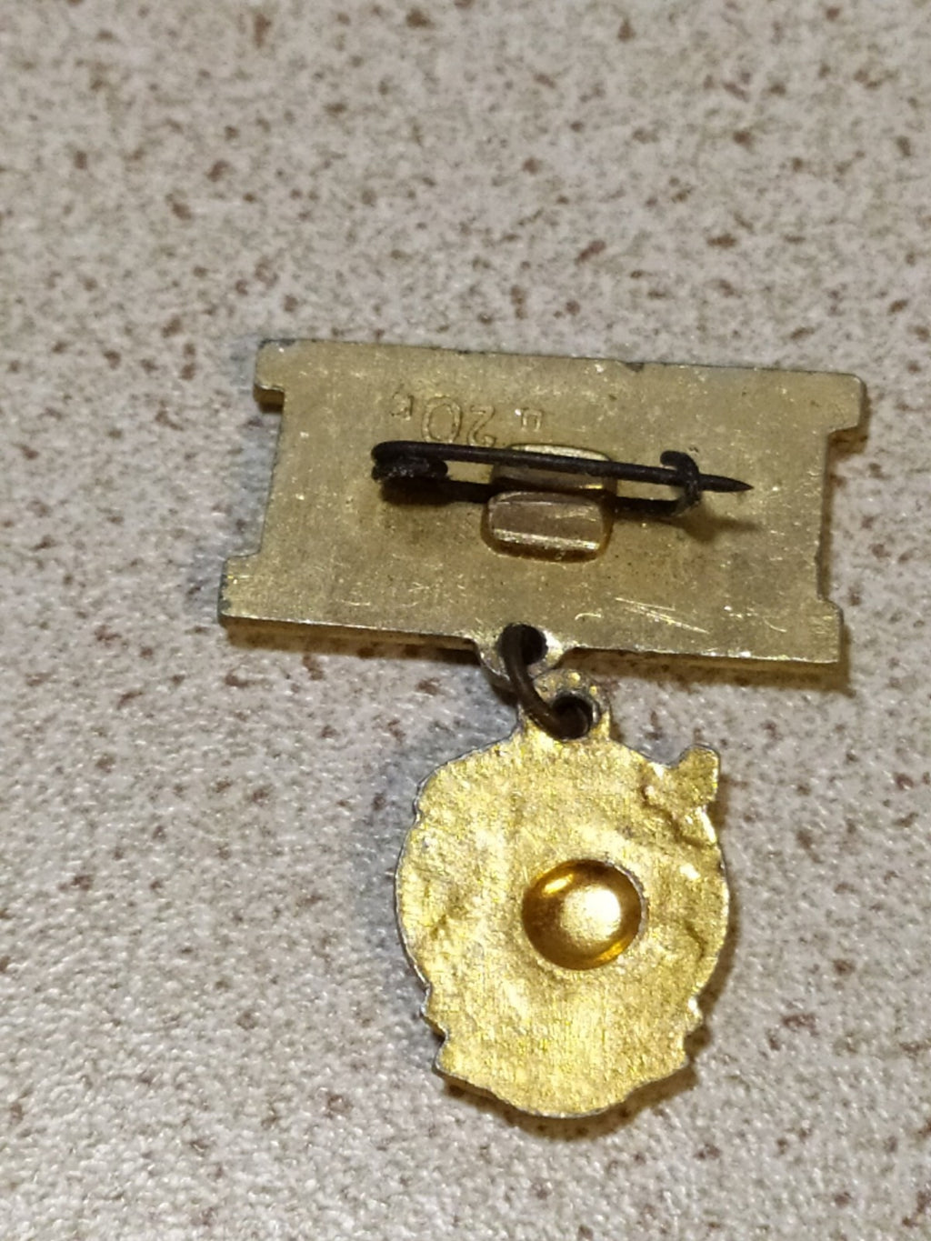 Reverse side of a Soviet anniversary pin badge