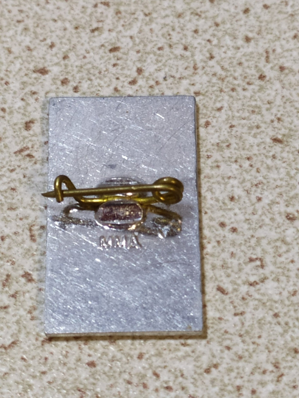 Back of the Soviet commemorative badge with pin fastening