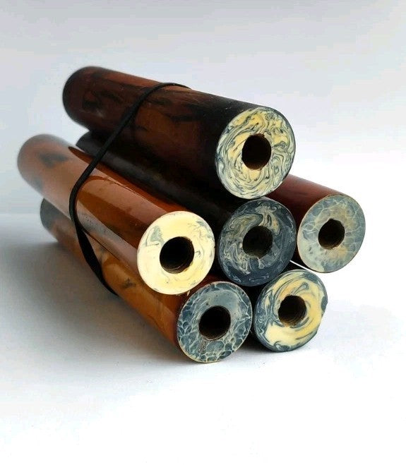 Vintage bakelite rods with deep swirl pattern, close-up of the marbling