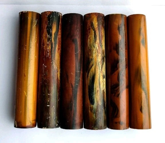 Marbled Catalin rod ends showing the hollow center for metal mounting