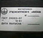 Black Proton 402 portable cassette recorder with attached power cord