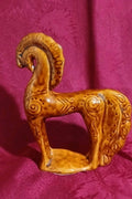 Soviet ceramic horse figurine in honey-brown majolica glaze with curved mane and tail
