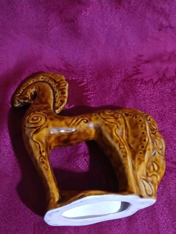 Glossy amber glaze on a Soviet Ukrainian folk art ceramic animal