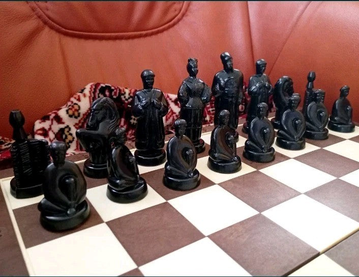 Black plastic Cossack chess pieces from a vintage Soviet chess set