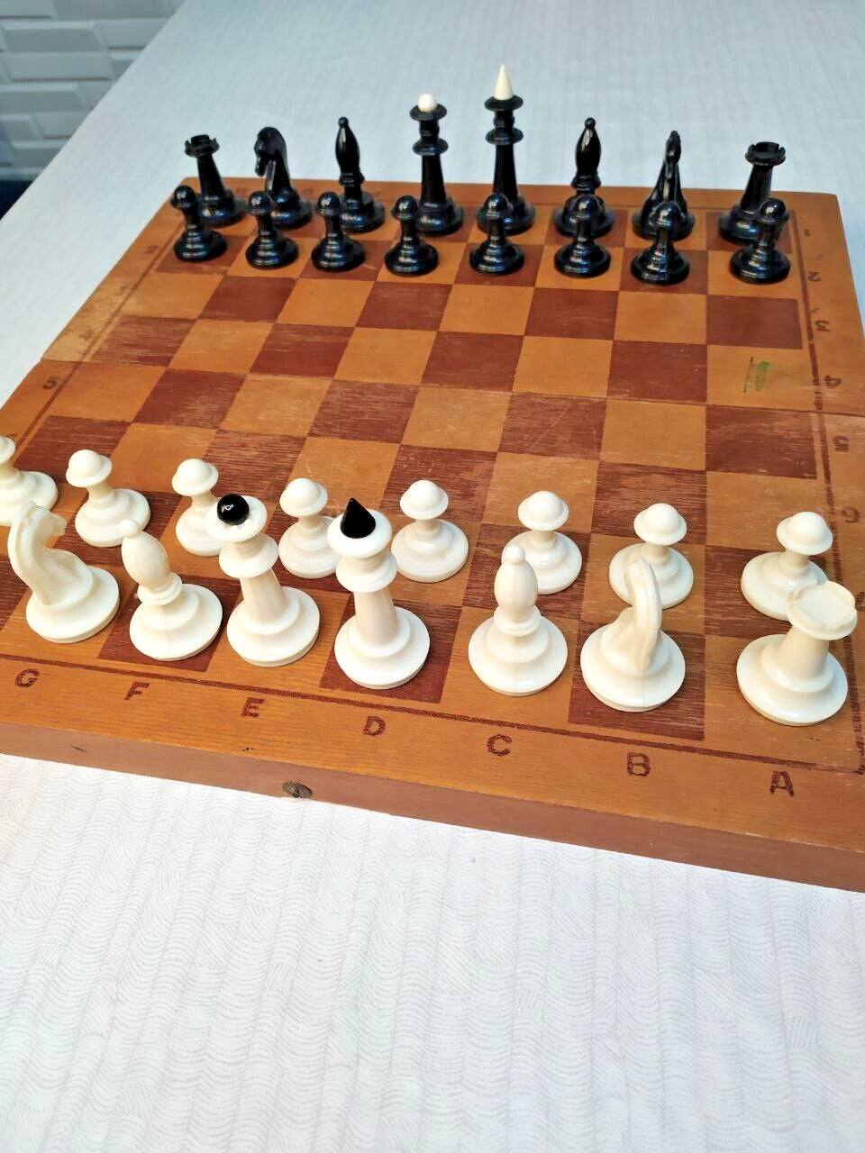 Soviet chess set with folding wooden board and weighted plastic pieces